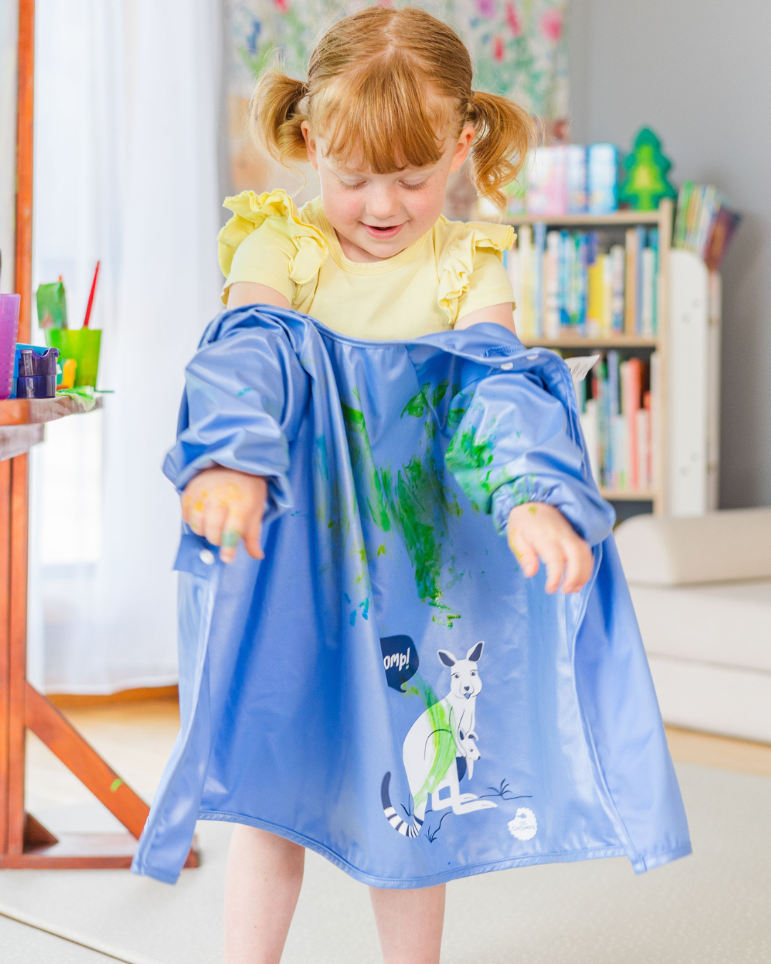 Art smock removed to show clean clothes.