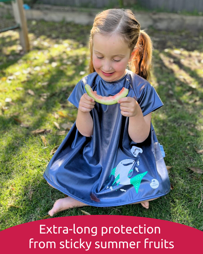 Girl wearing short sleeve smock bib eating watermelon.